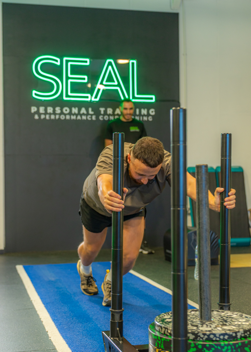 Sled push during Bootcamp session at SEAL Personal Training gym